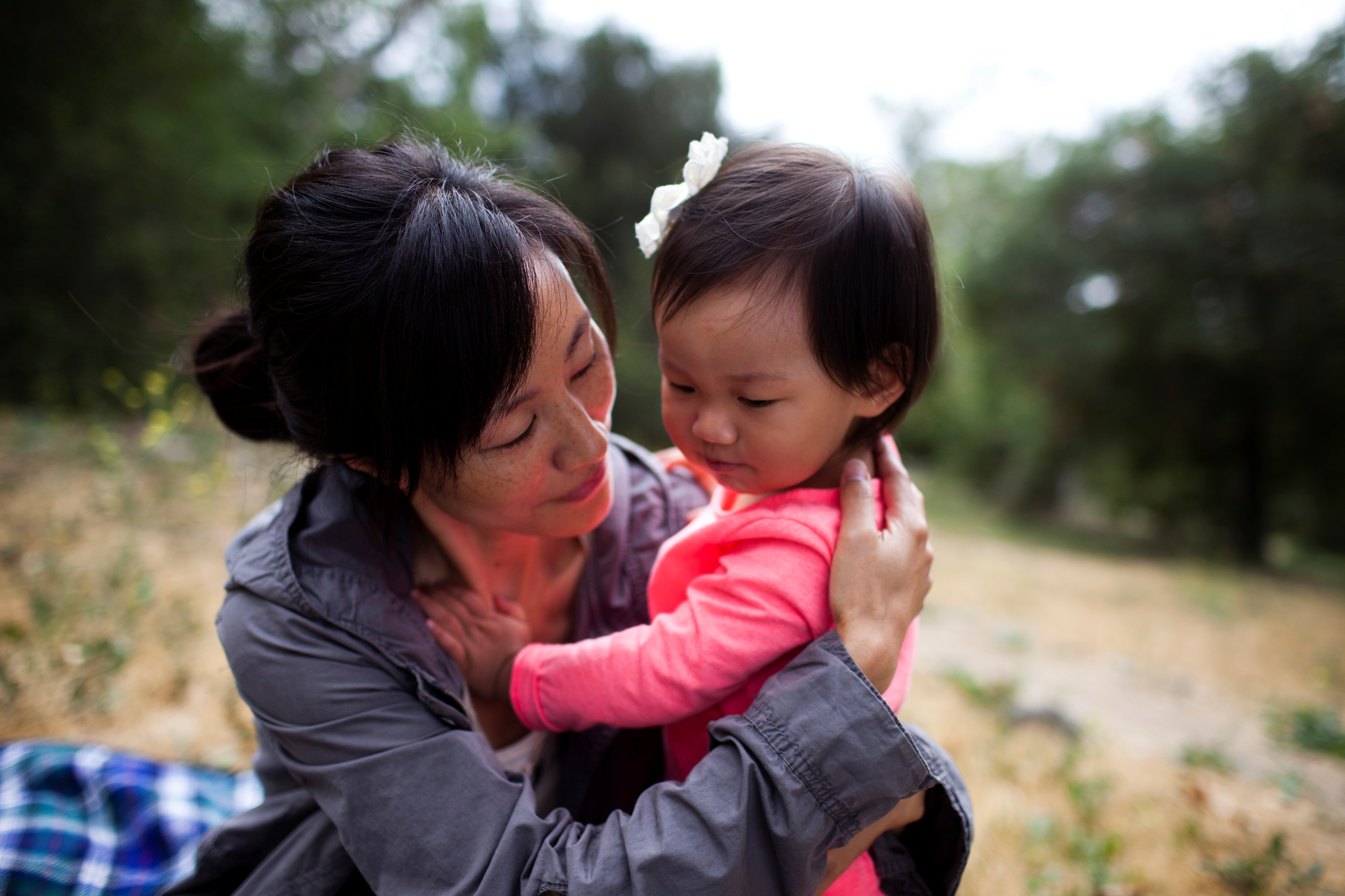 Mom holding young child